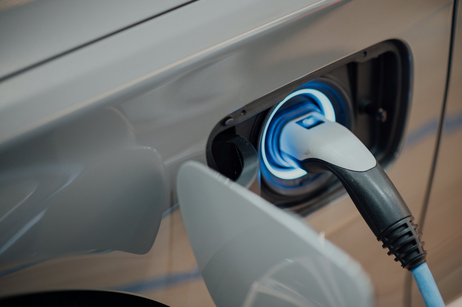Charging connector plugged into an electric car