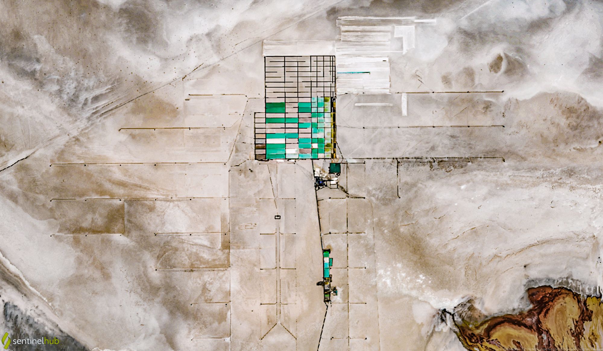 Satellite view of lithium brine evaporation ponds on the Salar de Uyuni, Bolivia